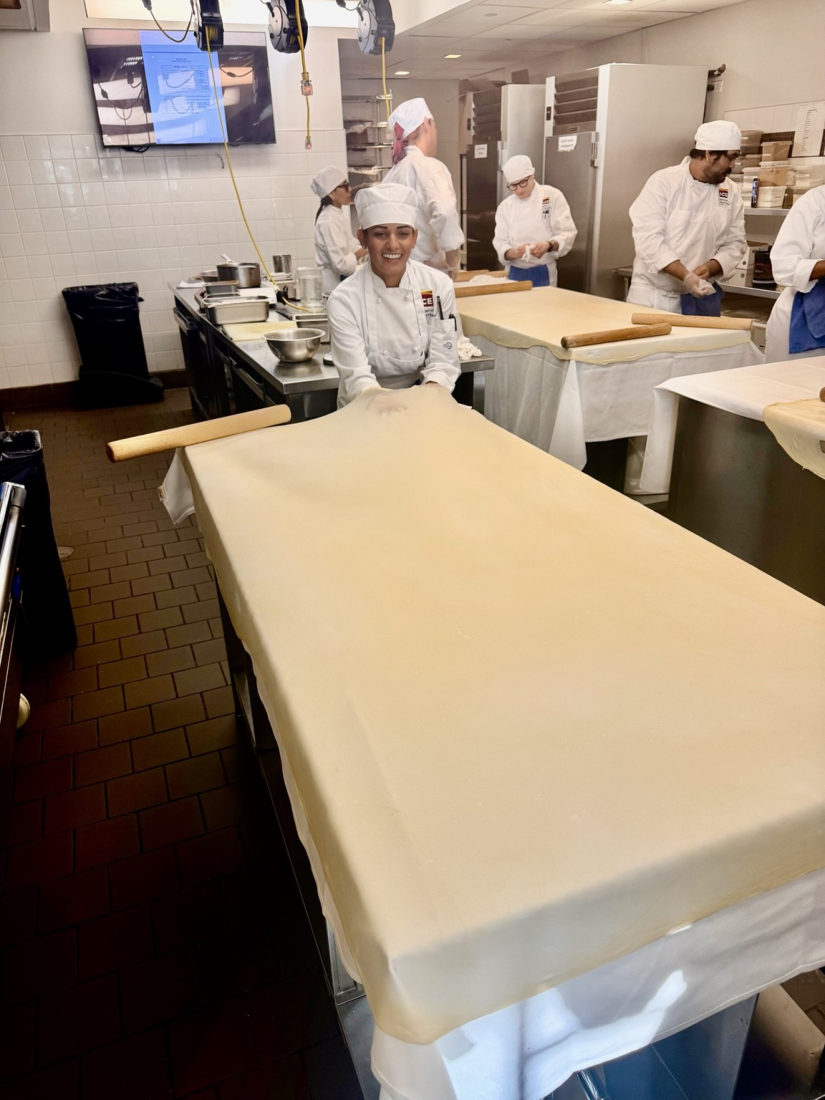 Aliya baking in the kitchen at the Institute of Culinary Education